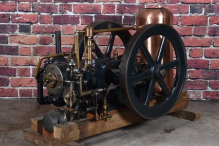 A side view of a bronze and black gas engine